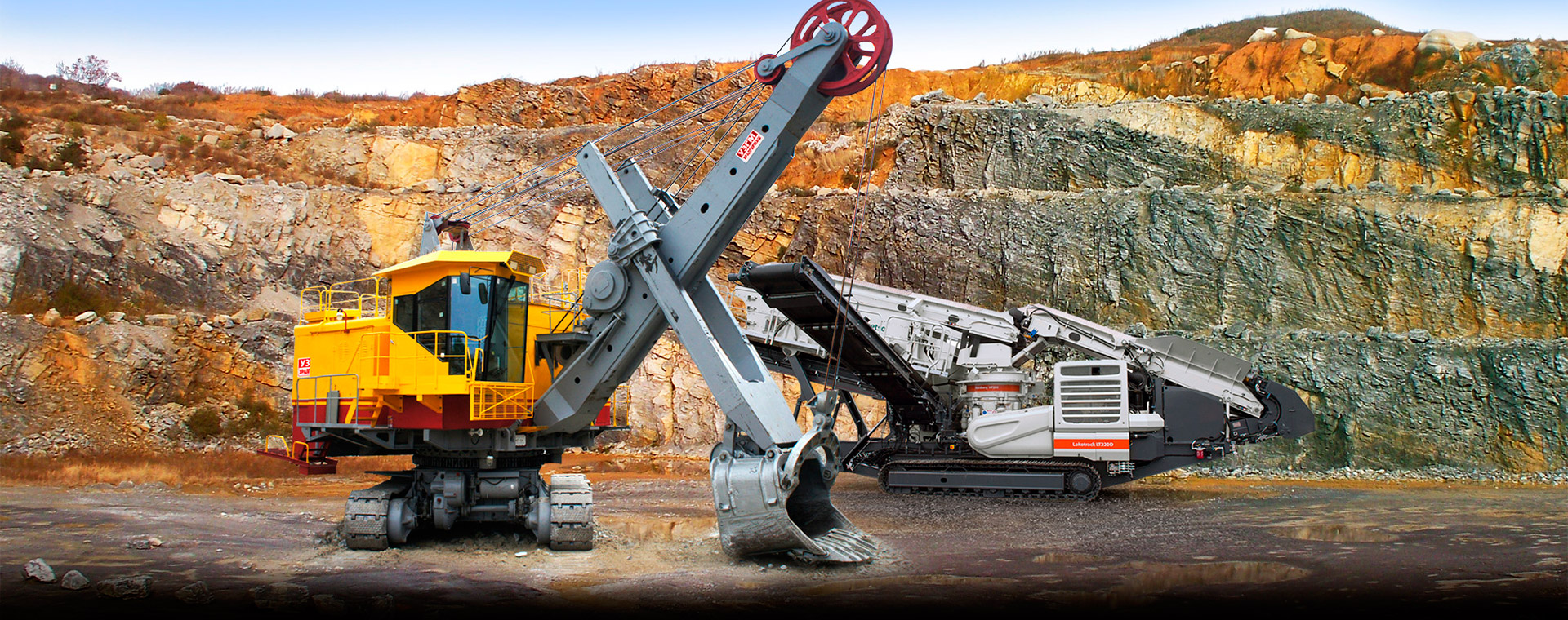 Горнодобывающее оборудование на карьере - дробилки и экскаваторы в работе